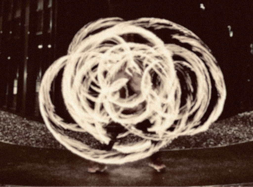 image of person spinning fire