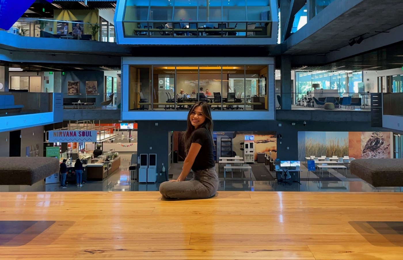 author sitting in main atrium at Intuit